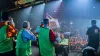 Photograph of Silver Geek Champions celebrating in front of a crowded auditorium